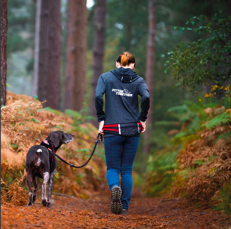 Person and dog walking using hands-free walking kit
